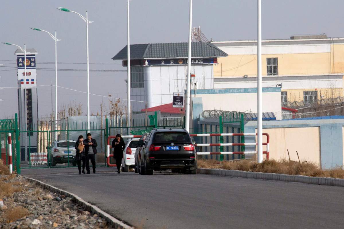 FILE.- In this Dec. 3, 2018, file photo, a police station is seen by the front gate of the Artux City Vocational Skills Education Training Service Center in Artux in western China’s Xinjiang region. Confidential documents, leaked to a consortium of news organizations, lay out the Chinese government’s deliberate strategy to lock up ethnic minorities to rewire their thoughts and the language they speak. One of the documents says that internment camps  such as the one in Artux  are to install police stations at gates, as well as other security measures to “prevent escapes”.
