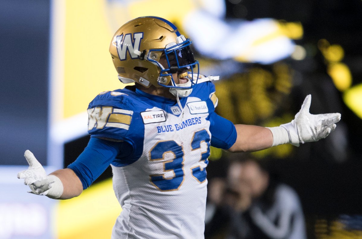 Winnipeg Blue Bombers' Andrew Harris celebrates his touchdown against the Hamilton Tiger-Cats during the first half of the 107th Grey Cup in Calgary, Alta., Sunday, November 24, 2019. 