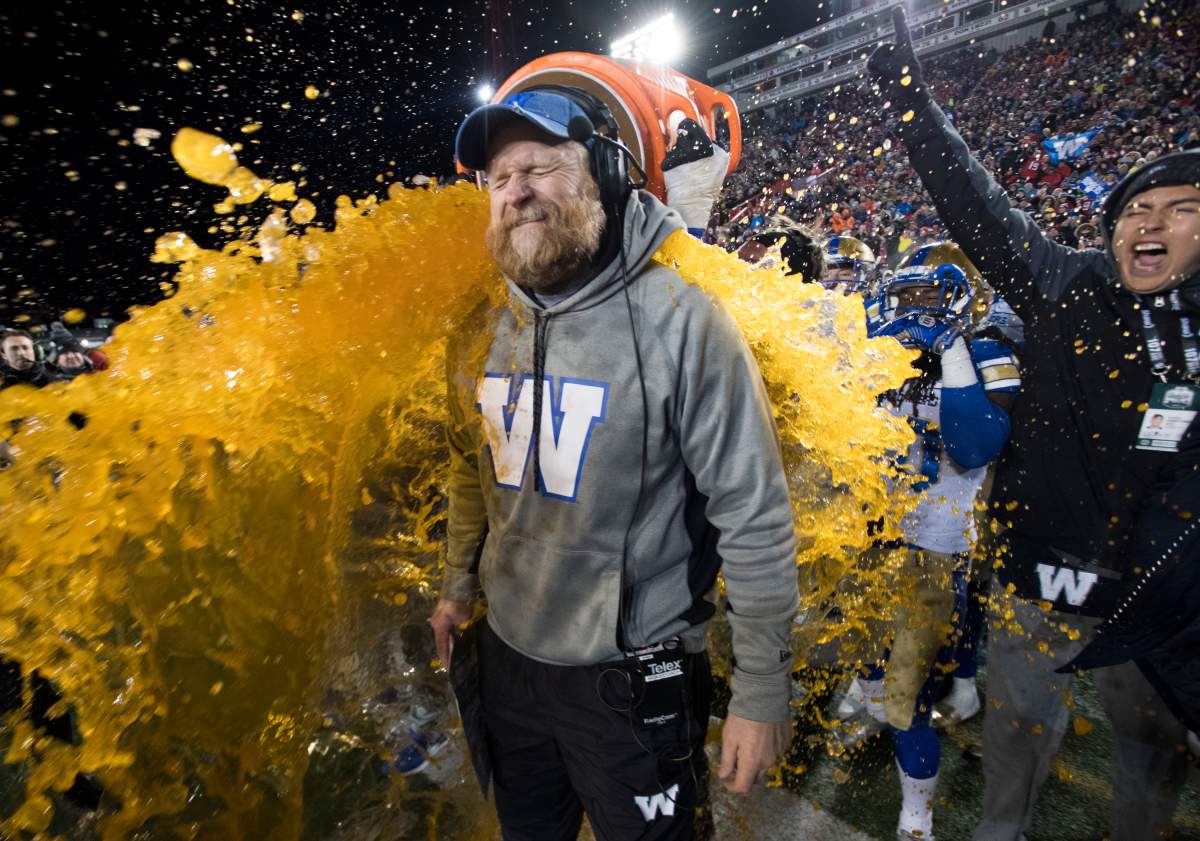 Winnipeg Blue Bombers head coach Mike O’Shea gets a sports drink poured over him as his team defeats the Hamilton Tiger Cats in the 107th Grey Cup in Calgary, Alta., Sunday, November 24, 2019.