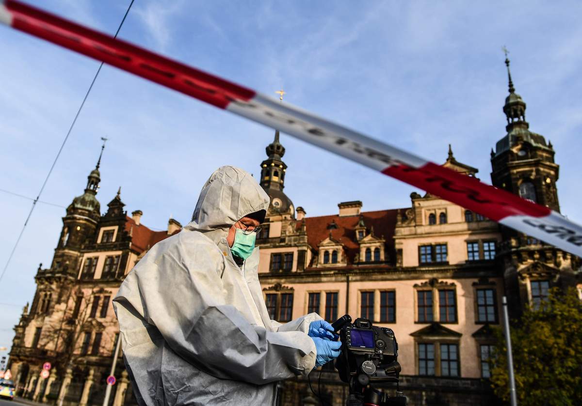 A police Forensics officer investigates the area near the Dresden Castle, in Dresden, Saxony, Germany, Nov. 25, 2019.