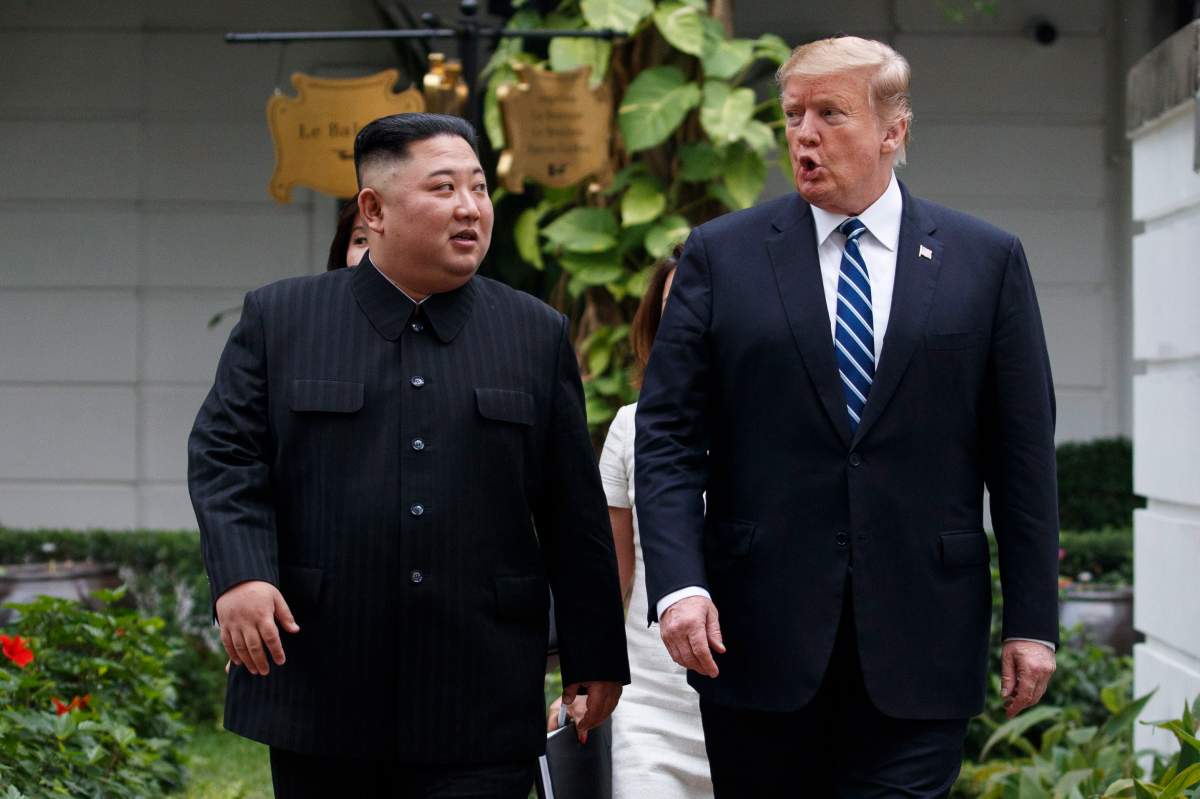 In this Feb. 28, 2019 photo, U.S. President Donald Trump, right, and North Korean leader Kim Jong Un take a walk after their first meeting at the Sofitel Legend Metropole Hanoi hotel, in Hanoi.
