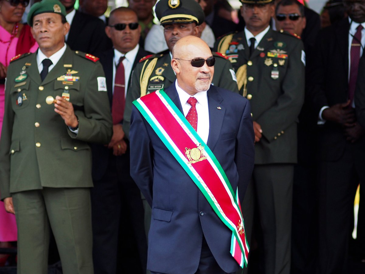 In this Aug. 12, 2015 file photo, Suriname President Desire "Desi" Delano Bouterse observes a military parade, after being sworn in for his second term, in Paramaribo, Suriname.