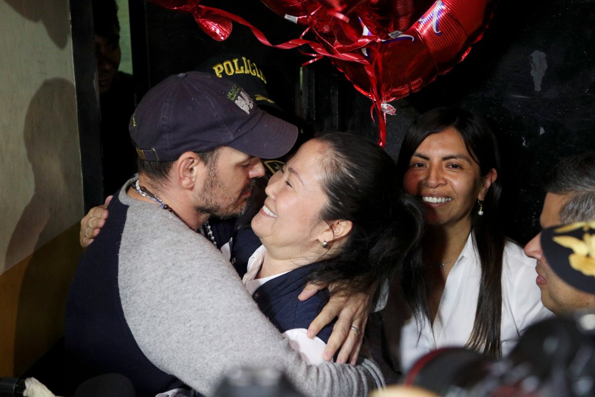 Keiko Fujimori, right, is embraced by her husband Mark Vito Villanela after she was released from Santa Mónica women's prison in Lima, Peru, Friday, Nov. 29, 2019.