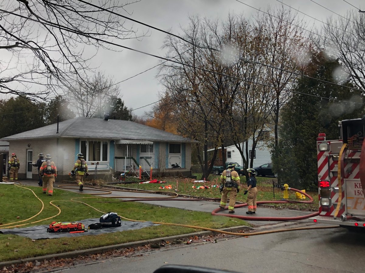 Crews tend to a fire in a detached garage at a home on McNay Street in London, Ont., Nov. 27, 2019.