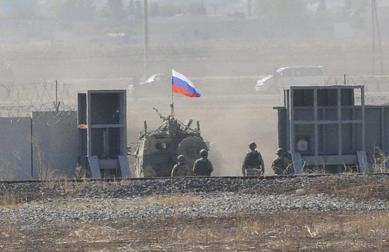 In this photo taken from the outskirts of Suruc, southeastern Turkey, AaRussian army vehicle enters Syria, as it begins its joint patrol with Turkish forces, Tuesday, Nov. 5, 2019. Turkey and Russia launched joint patrols for the second time in northeastern Syria, under a deal that halted a Turkish offensive against Syrian Kurdish fighters who were forced to withdraw from the border area following Ankara's incursion. 