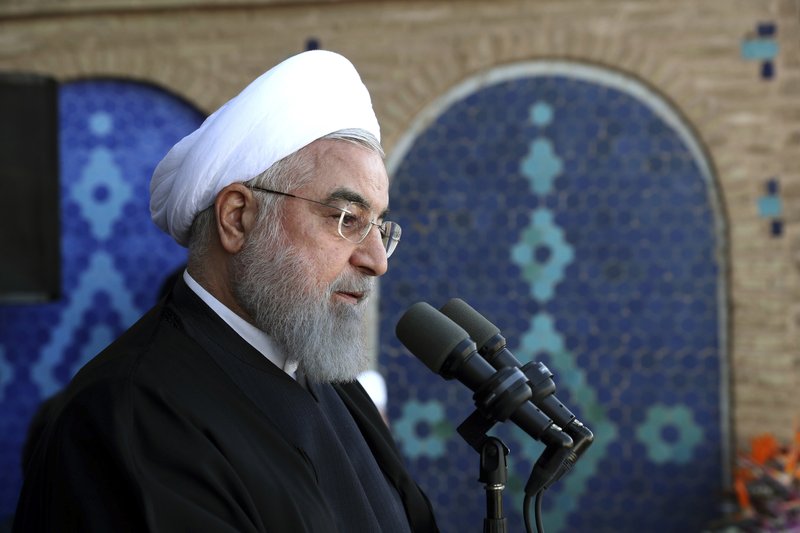 In this photo released by the official website of the office of the Iranian Presidency, President Hassan Rouhani speaks in a public gathering at the city of Yazd, some 410 miles (680 kilometers) southeast of the capital Tehran, Iran, Sunday, Nov. 10, 2019. Iran has discovered a new oil field in the country's south with over 50 billion barrels of crude oil, Rouhani said Sunday, a find that could boost the country's proven reserves by a third as it struggles to sell energy abroad over U.S. sanctions. 