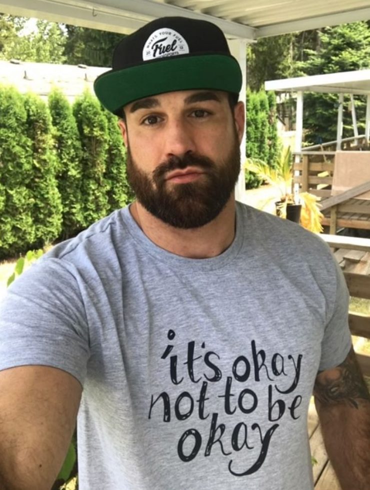 Professional boxer Adam Braidwood wearing an “It’s okay not to be okay” T-shirt.