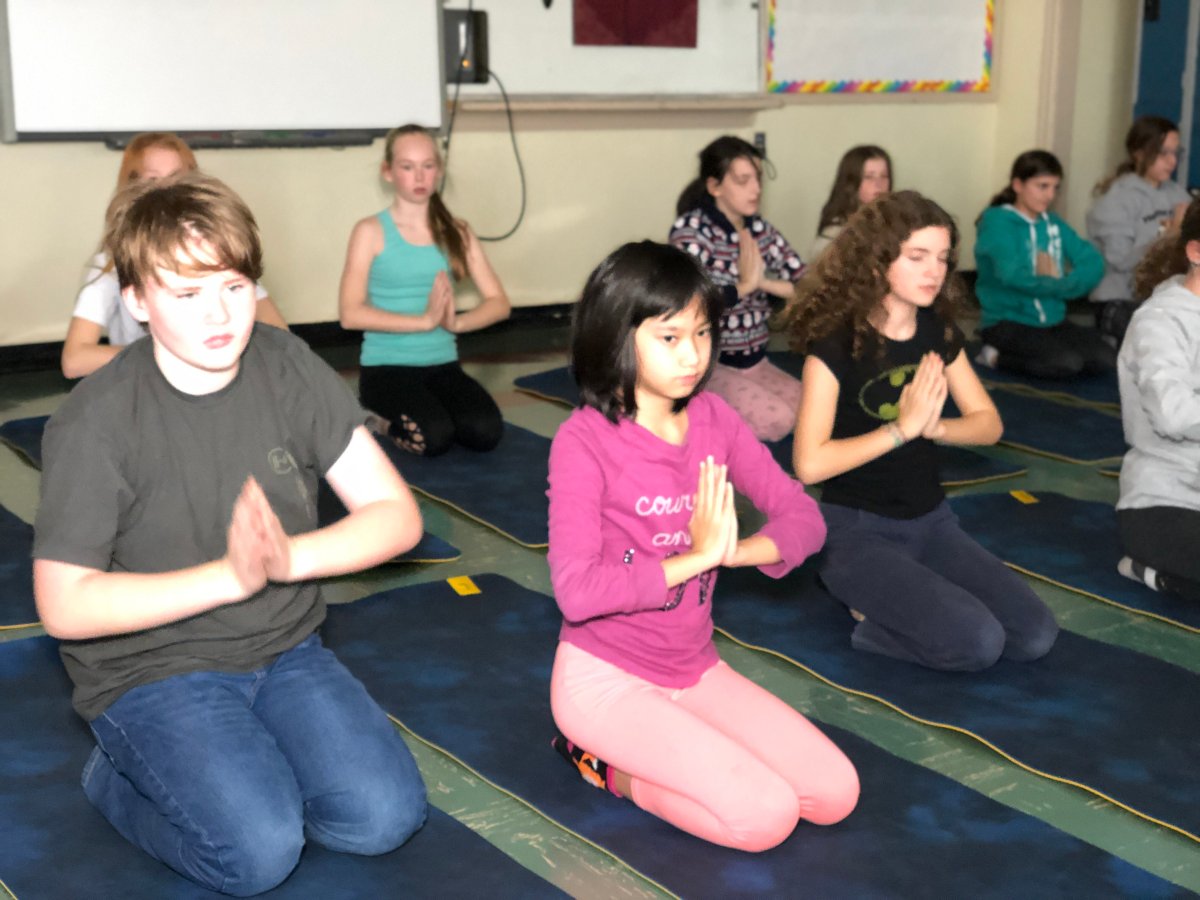 Students take part in a new yoga class at Hillcrest School in Moncton.