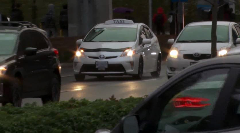 A Coquitlam woman claims she was held against her will in a taxi after a fare dispute with the driver. 