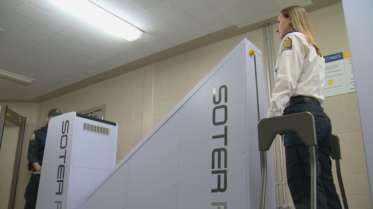 Regina Correctional Centre staff demonstrate their new body scanner. 