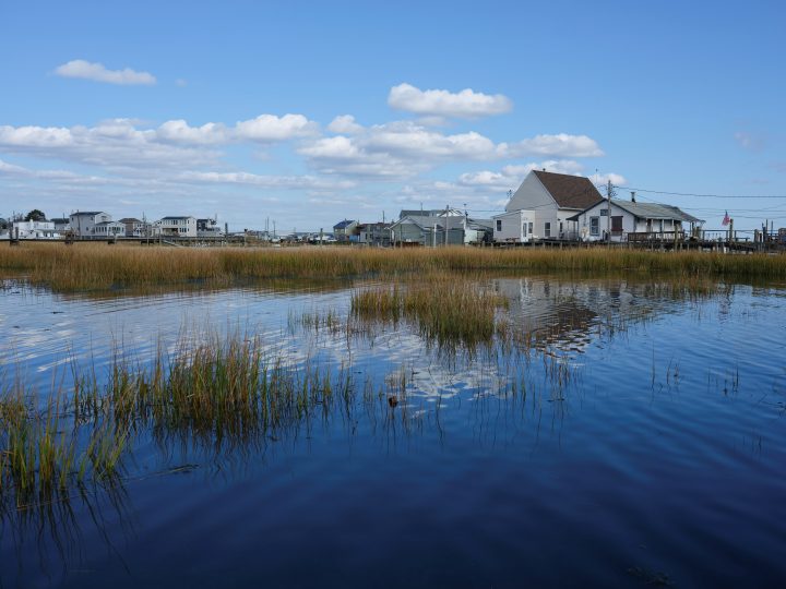 Houses elevated on wooden pilings rest over water in the Broad Channel neighborhood of Queens in New York City, U.S., November 2, 2019. Picture taken November 2, 2019.  