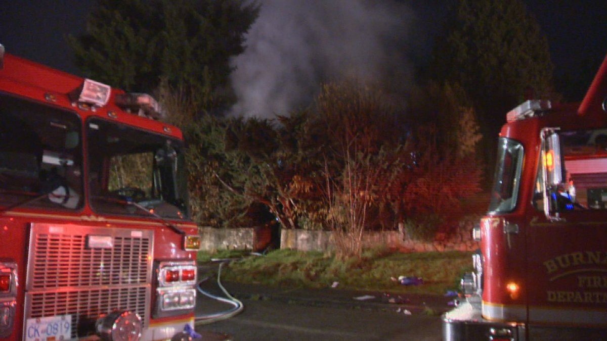 Burnaby fire crews on the scene of a house fire where a man had to be saved from inside the home on March 30, 2018. The firefighter who saved the resident has been awarded a Medal of Bravery by the province.