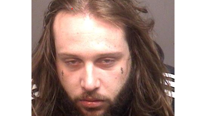The 26-year-old suspect is Tyler Wren, who is of no fixed address, police say. He is described to be five-foot-six in height, 188 pounds, with a thin build, brown hair, blue eyes, a beard and small facial tattoos under each eye, police add.