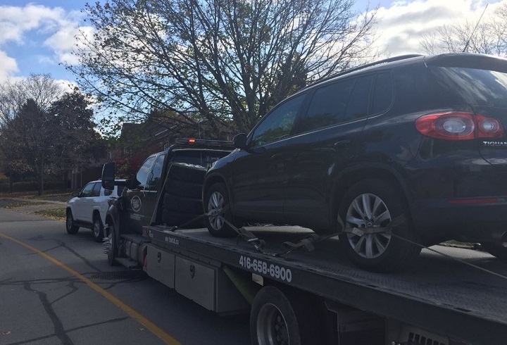 An SUV was impounded after two people were allegedly found in the trunk.