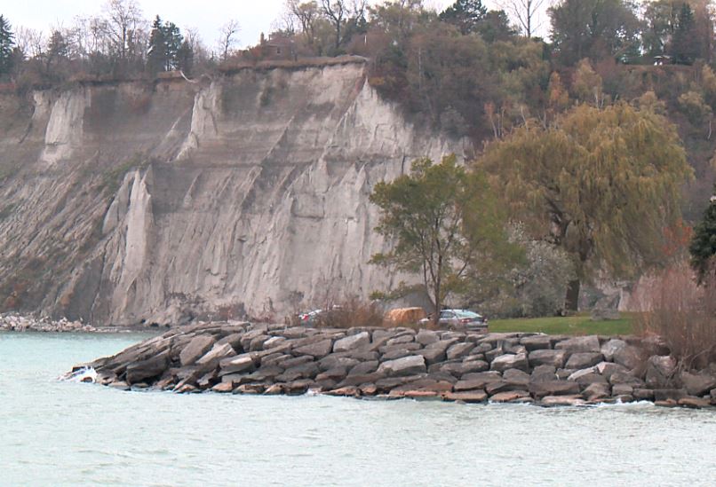 Police examine a pick-up truck found on fire at the Scarborough Bluffs.