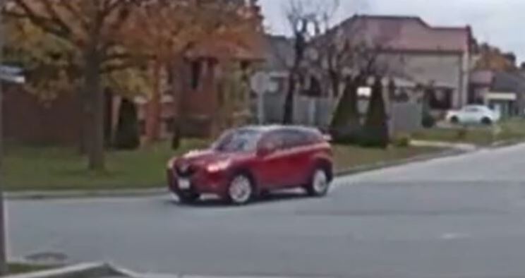 Police say investigators are looking to identify the driver of a red SUV in connection with an attempted abduction investigation.