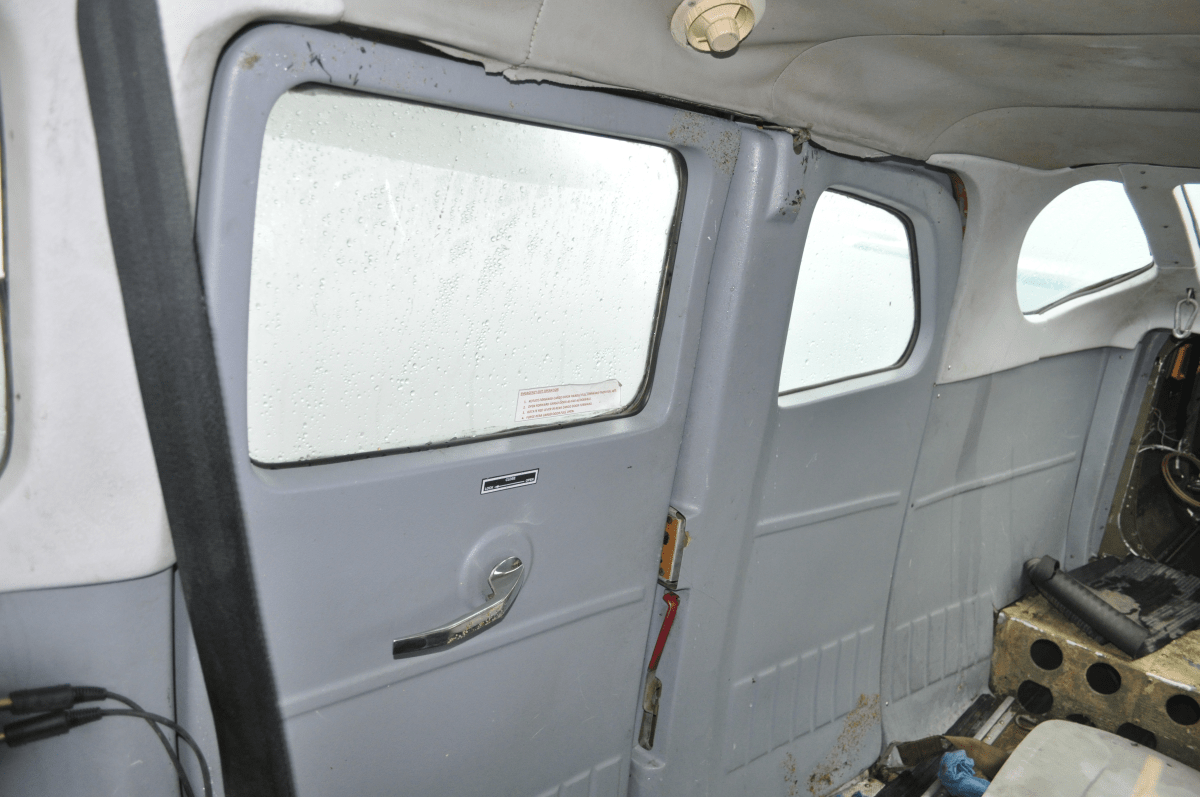 Interior view of the Cessna 206 rear double cargo door in the closed position.