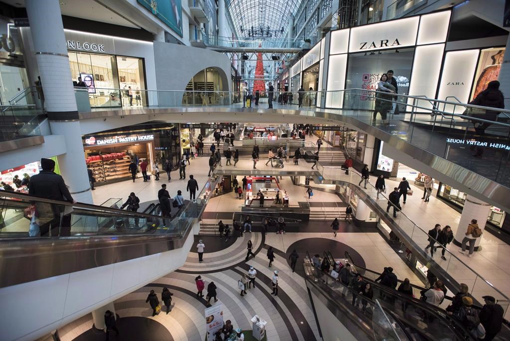 People walk at the Eaton Centre in Toronto on Wednesday, Dec. 26, 2018. 