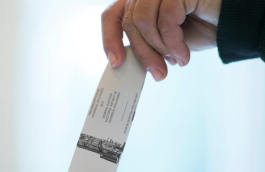A woman casts her ballot in the riding of Vaudreuil-Soulanges, west of Montreal, on election day on October 19, 2015. Courts in Quebec and British Columbia have ordered recounts in two ridings where the runners-up are hoping a review could snatch victories from the jaws of every-so-narrow losses. THE CANADIAN PRESS IMAGES/Graham Hughes.