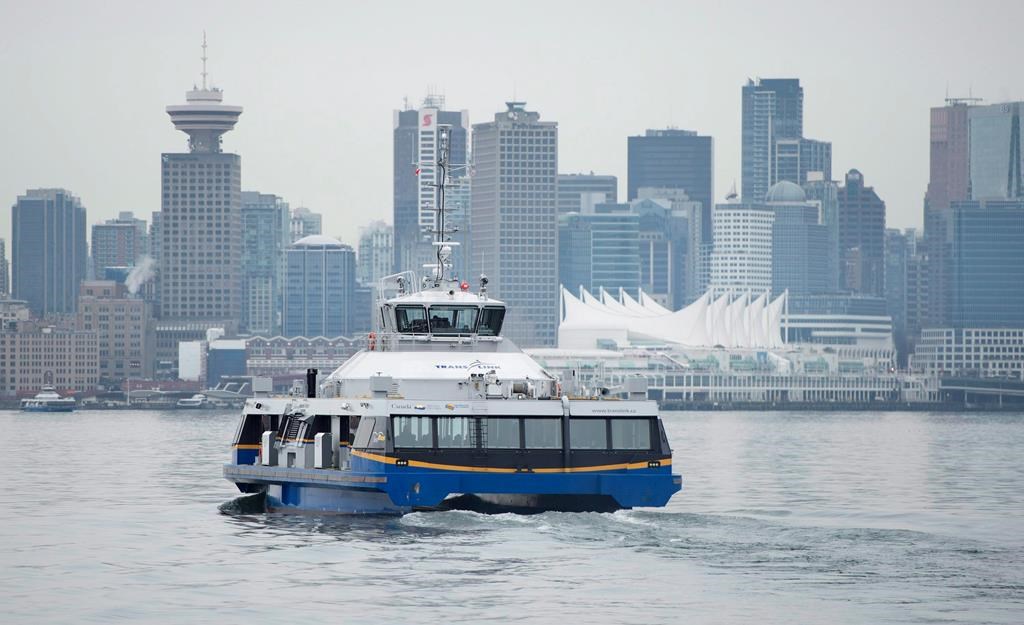 Downtown Vancouver is pictured in the background as a translink Seabus leaves North Vancouver, B.C.