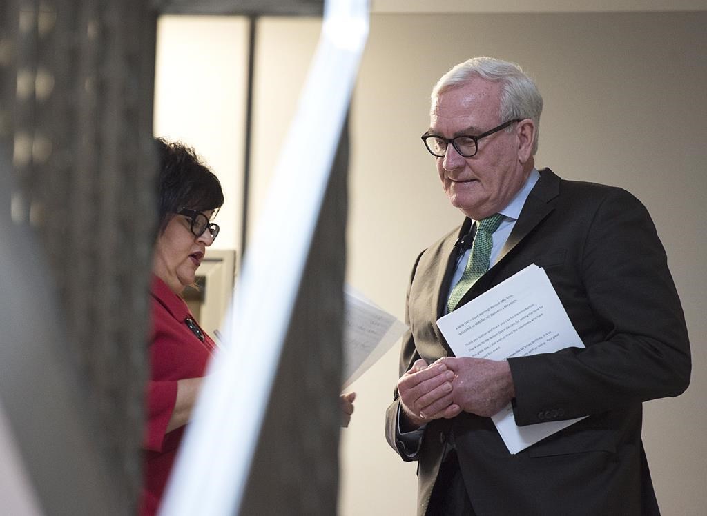 Kevin Vickers, the former House of Commons sergeant-at-arms, is briefed by Lisa Harris, left, MLA for Miramichi Bay-Neguac, before he announces his intention to run for the leadership of the New Brunswick Liberals, in Miramichi, N.B. on Friday, March 15, 2019.