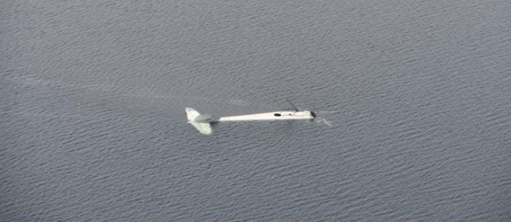 The wreckage of a float plane owned by Quebec airline Air Saguenay is shown after it crashed into a Labrador lake in this 2019 handout photo.
