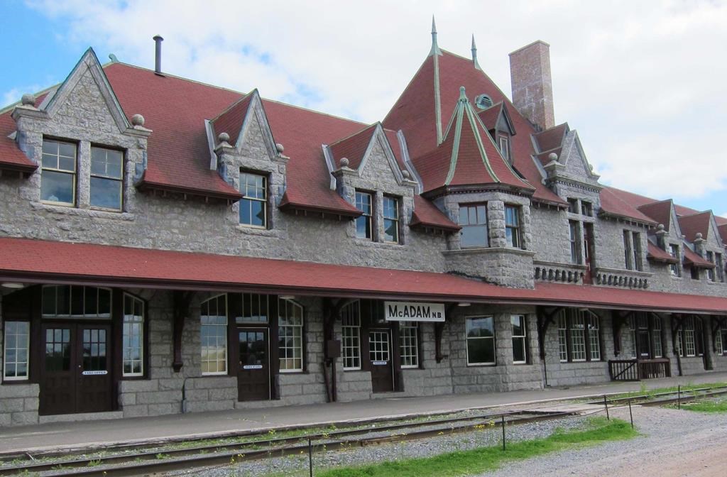 The exterior of the historic railway station in McAdam, N.B., once part of Canadian Pacific Railway's main line into Atlantic Canada, is shown on June 16, 2012. A year after a tiny village in New Brunswick attracted national attention by announcing it would sell 16 housing lots for $1 apiece, the mayor says the novel bid to attract newcomers has been an unqualified success.