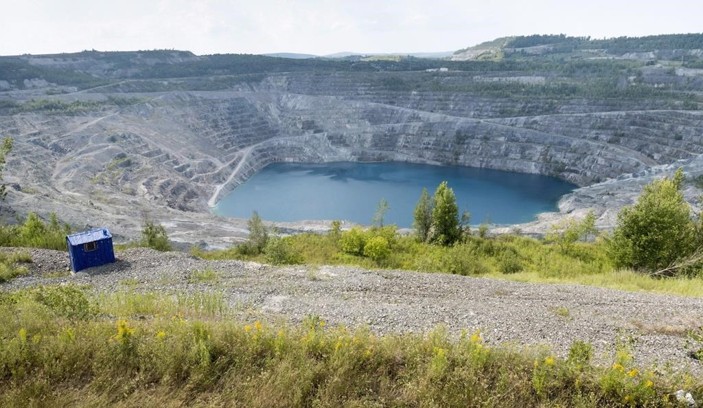 The open pit of the now closed Jeffrey mine is seen in Asbestos, Que., Wednesday, Aug. 10, 2016. THE CANADIAN PRESS/Paul Chiasson