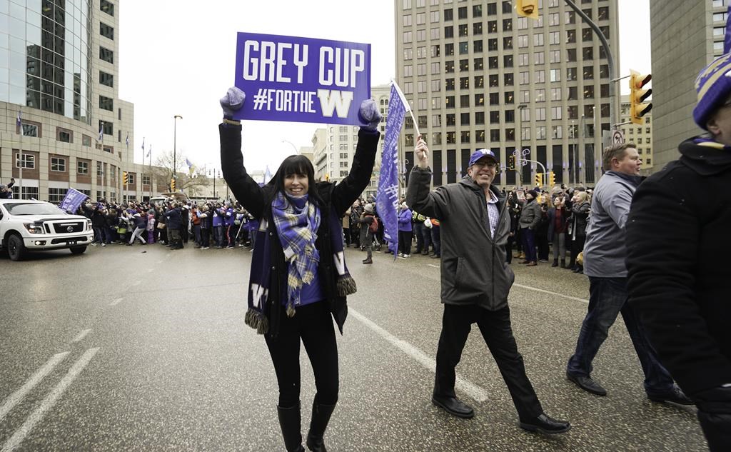 Chair of Winnipeg Blue Bombers board of directors Dayna Spiring joins Winnipeggers on downtown streets Tuesday, Nov. 26, 2019, to celebrate the end of a Grey Cup drought that lasted almost three decades. Spiring is the first woman in Grey Cup history to have her name appear on the trophy. THE CANADIAN PRESS/HO-Economic Development Winnipeg, Tyler Walsh, *MANDATORY CREDIT*.