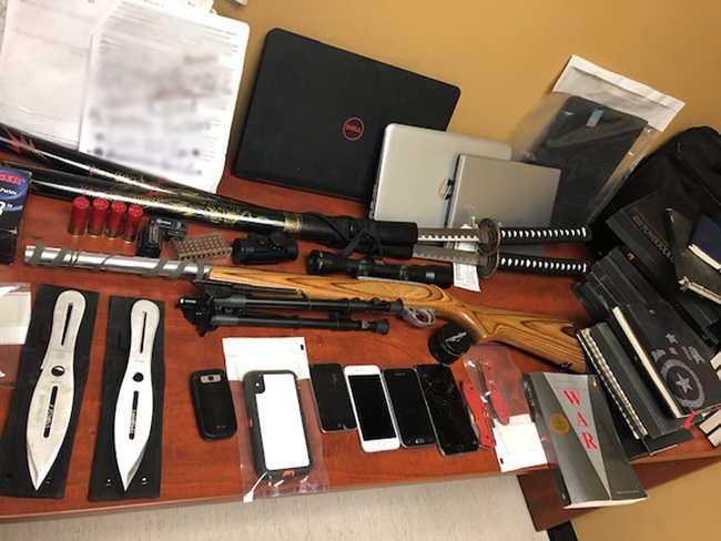 Items seized by RCMP after an investigation into online threats against police.