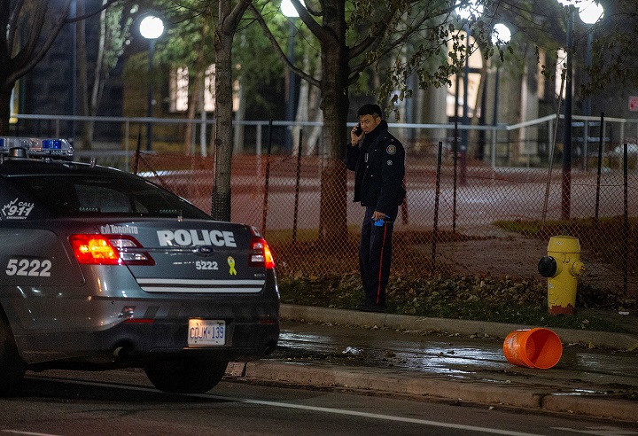 Toronto police at the scene investigating after a bucket of feces was thrown at a female victim at the University of Toronto campus.
