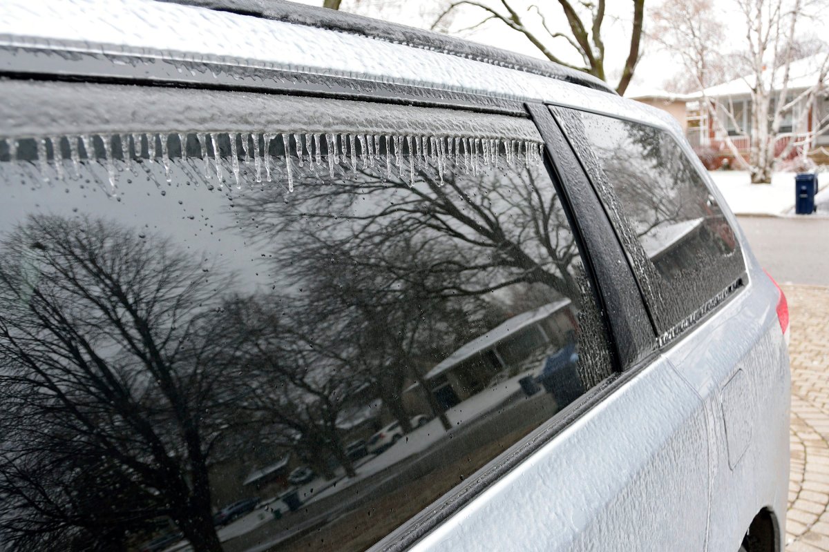 Icicles and ice as seen on a parked car in the morning after freezing rain continues in Toronto, Ont., March 25, 2016. 