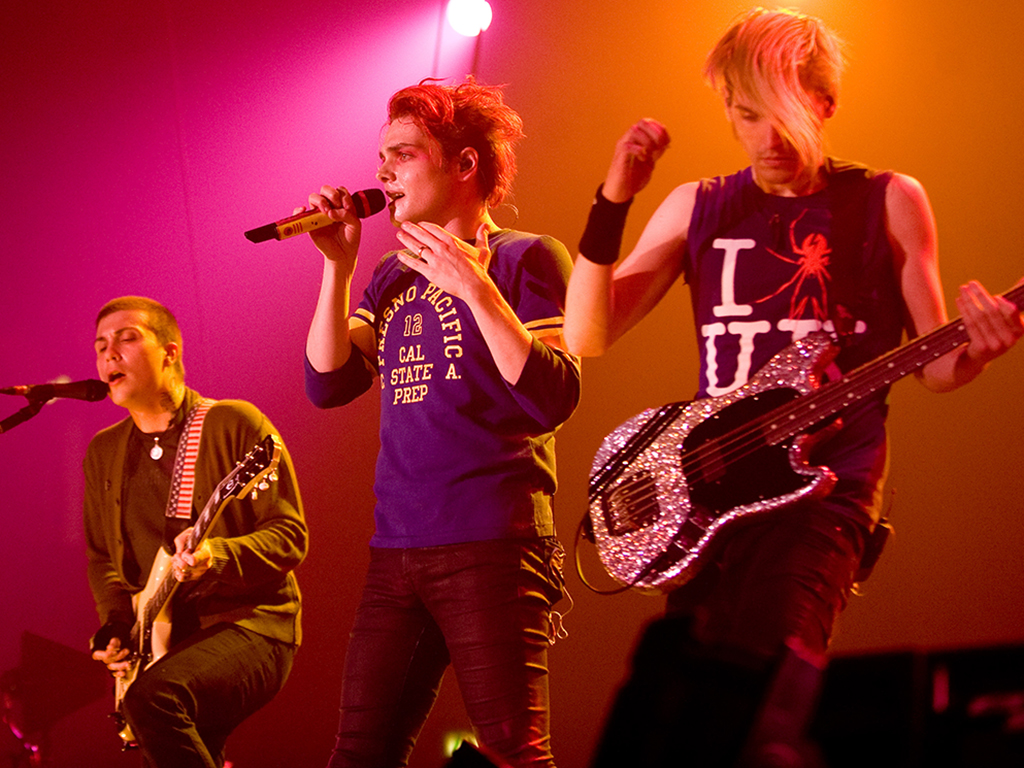 (L-R) Frank Iero, Gerard Way and Mikey Way of My Chemical Romance perform at Wembley Arena on Feb. 12, 2011 in London, England.
