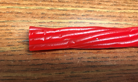 A small needle is shown in a licorice candy that one parent found in their child's Halloween candy.