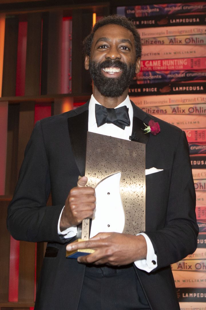 Ian Williams celebrates winning the 2019 Giller Prize for his book “Reproduction” at a gala ceremony in Toronto, on Monday November 18, 2019.