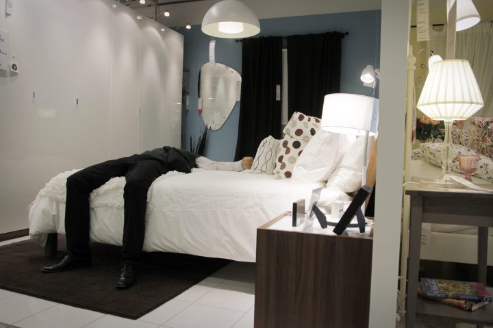 A customer lounges on a bed at an Ikea store in this file photo.