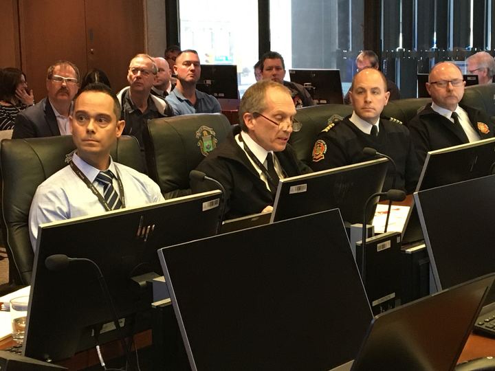 Winnipeg fire chief John Lane (centre) speaks at a city council committee meeting Saturday. 