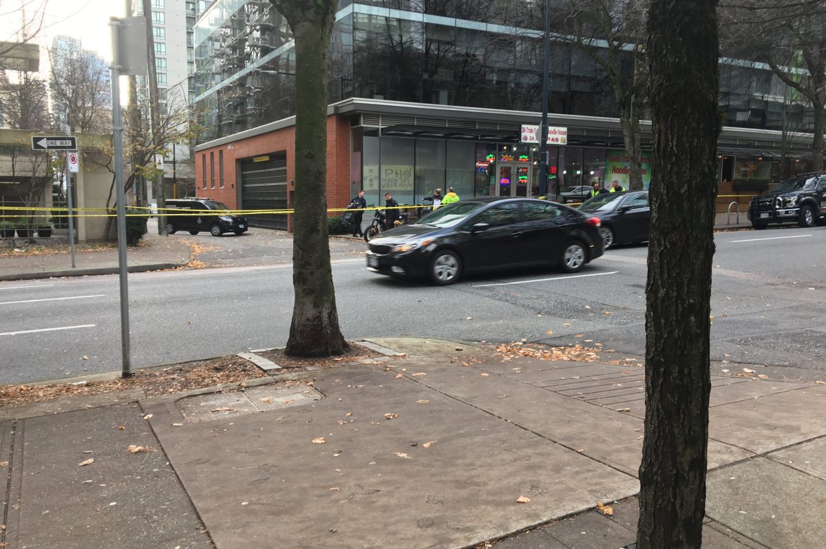 Police at the scene of a fatal motorcycle crash in downtown Vancouver on Nov. 24, 2019.