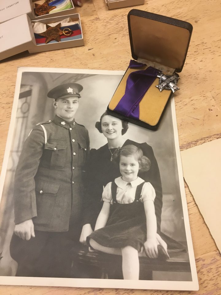 A photo of Robert Finch, his wife Elizabeth and daughter Helen, and the Memorial Cross.