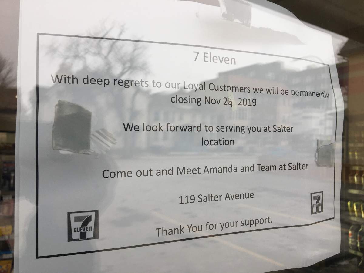 A notice on the window of the convince store.