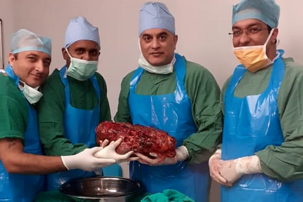 Doctors at Sir Ganga Ram Hospital in Delhi, India, hold a 7.4-kilogram kidney they removed from a patient on Nov. 26, 2019.