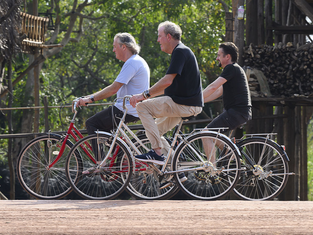 (L-R) James May, Jeremy Clarkson, and Richard Hammond enjoy a bike ride together on Amazon Prime Video’s ‘The Grand Tour Presents: Seamen’ — which premieres on Friday, Dec. 13, 2019.