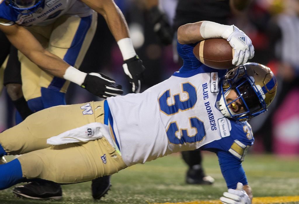 Winnipeg Blue Bombers' Andrew Harris scores a touchdown against the Hamilton Tiger Cats during first half football action in the 107th Grey Cup in Calgary, Alta., Sunday, November 24, 2019.