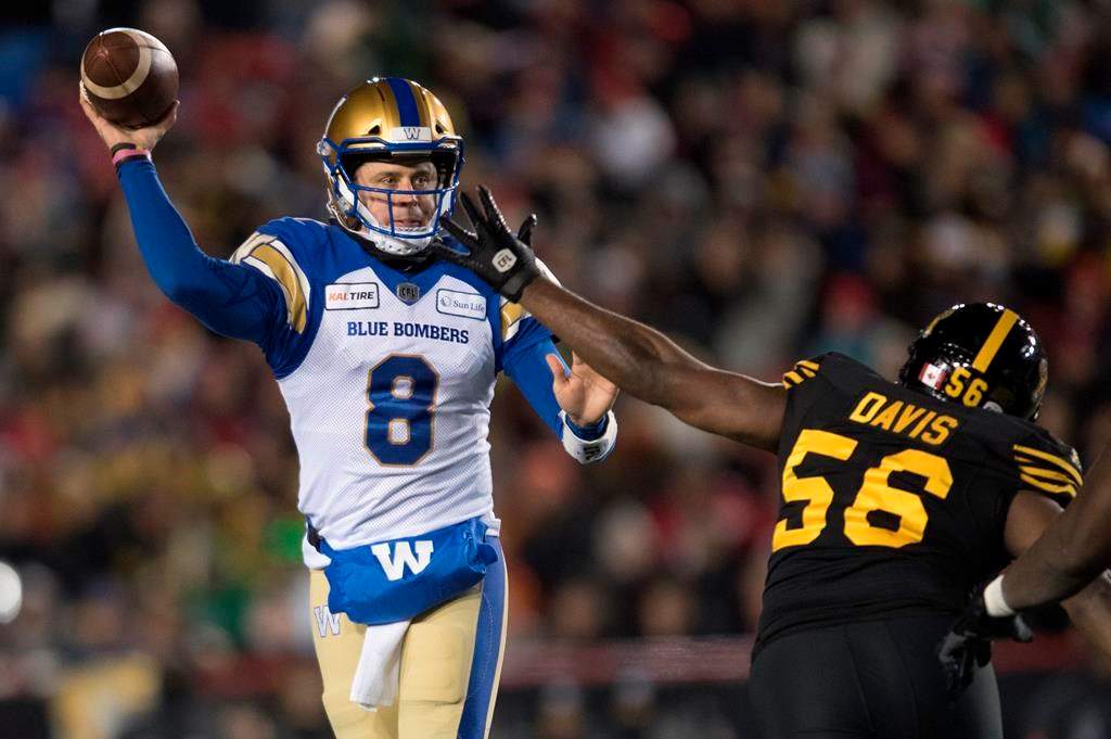 Hamilton Tiger-Cats' Ja'Gared Davis tries to stop Winnipeg Blue Bombers quarterback Zach Collaros from throwing the ball during the second half of the 107th Grey Cup in Calgary, Alta., Sunday, November 24, 2019.