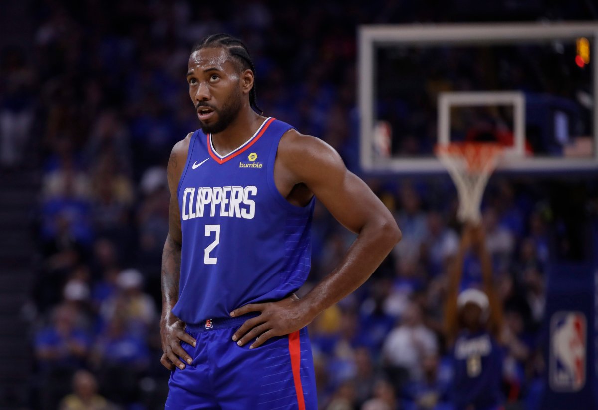 Los Angeles Clippers' Kawhi Leonard looks at the scoreboard during the first half of the team's NBA basketball game Golden State Warriors on Thursday, Oct. 24, 2019, in San Francisco.