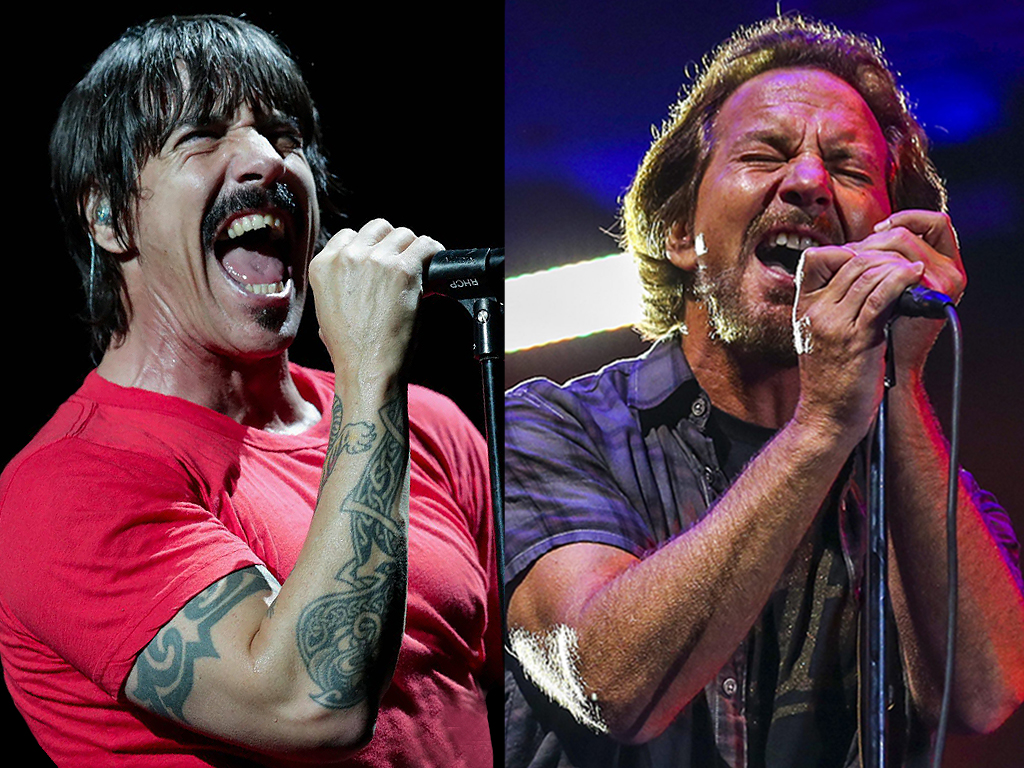 (L-R) Anthony Kiedis of Red Hot Chili Peppers and Eddie Vedder of Pearl Jam, perform live onstage.