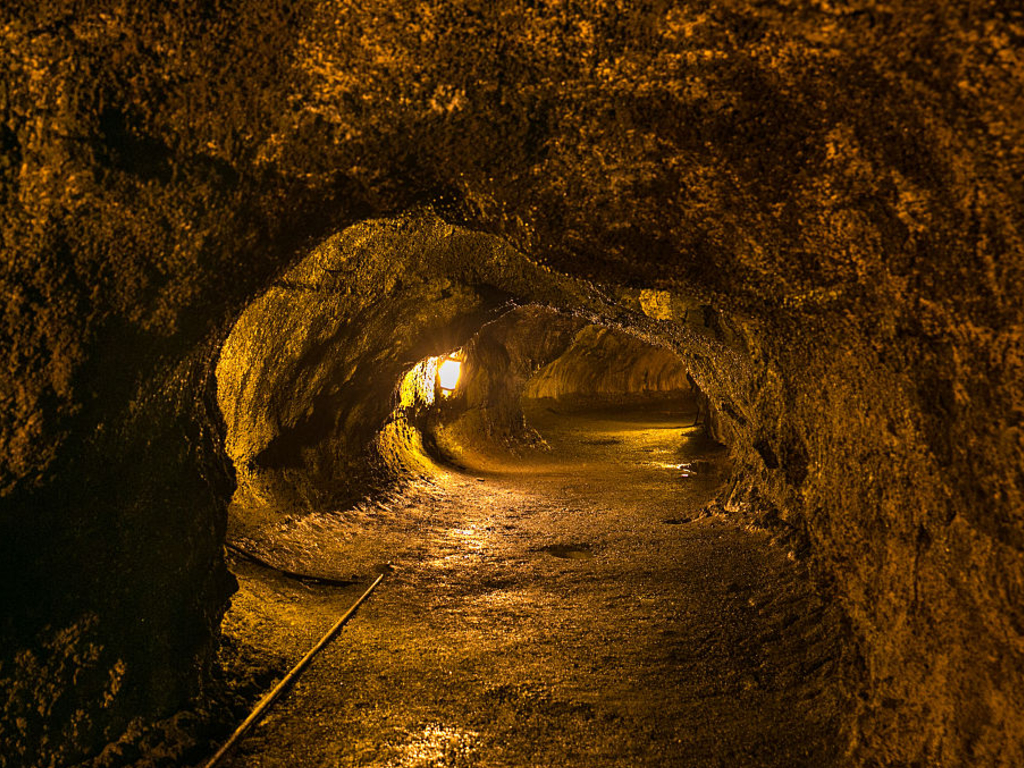 A dark and damp trail through the Thurston Lava Tube is viewed at Volcanoes National Park, Hawaii.