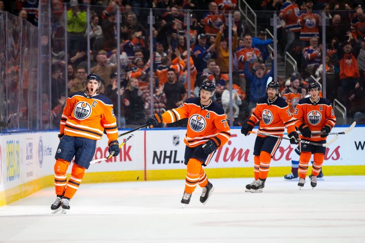 Connor McDavid (97), Oscar Klefbom (77), James Neal (18) and Ryan Nugent-Hopkins (93) of the Edmonton Oilers celebrate McDavid’s goal against the Colorado Avalanche at Rogers Place in Edmonton on Thursday, Nov. 14, 2019.