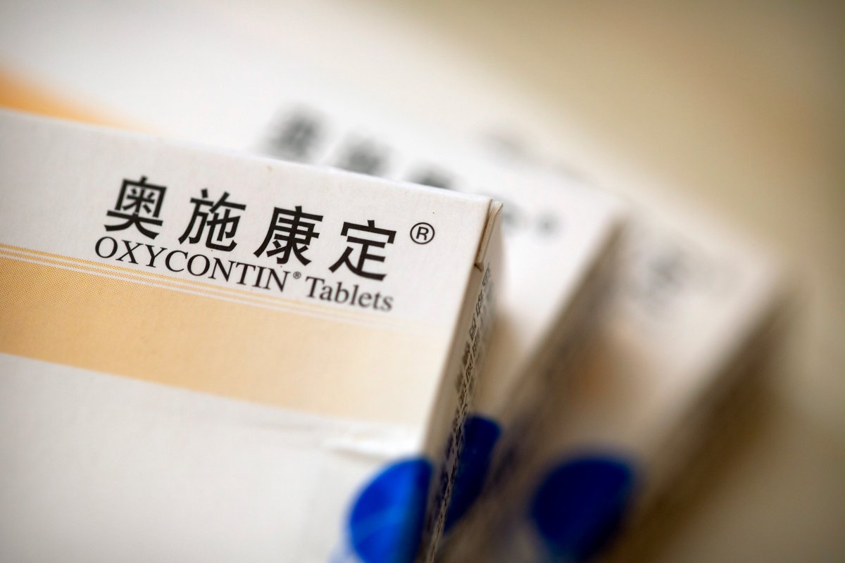 Boxes of OxyContin tablets sold in China sit on a table in southern China's Hunan province on Sept. 24, 2019. Representatives from the Sacklers' Chinese affiliate, Mundipharma, tell doctors that OxyContin is less addictive than other opioids  the same pitch that their U.S. company, Purdue Pharma, admitted was false in court more than a decade ago. 