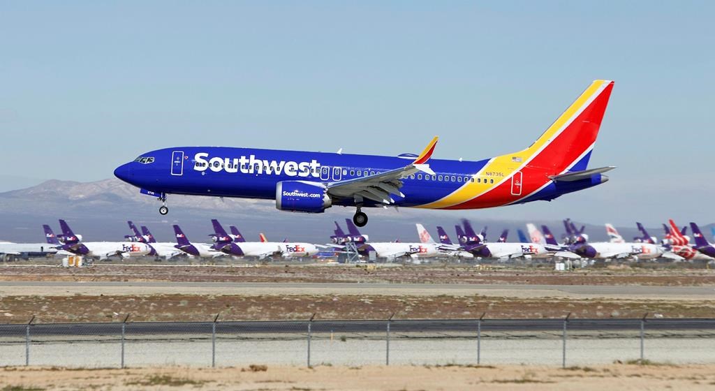 FILE - In this March 23, 2019, file photo, a Southwest Airlines Boeing 737 Max aircraft lands at the Southern California Logistics Airport in the high desert town of Victorville, Calif.